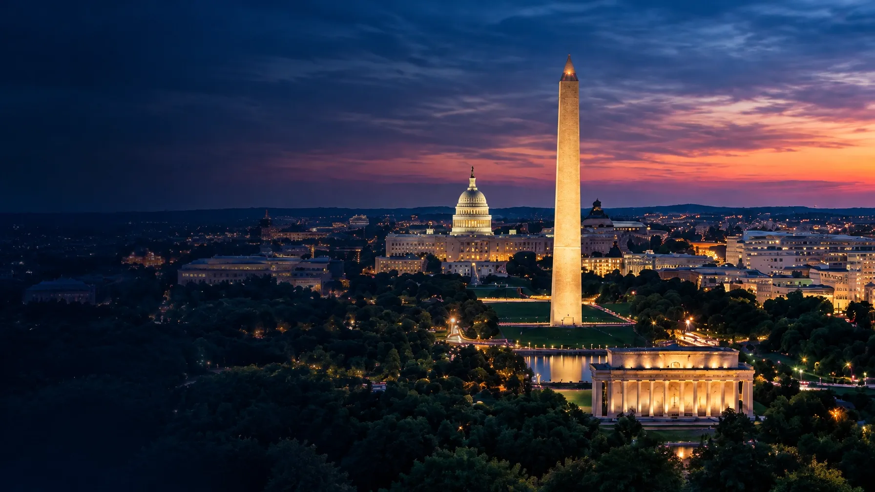 Washington DC at dusk, with the Washington Monument and Capitol illuminated